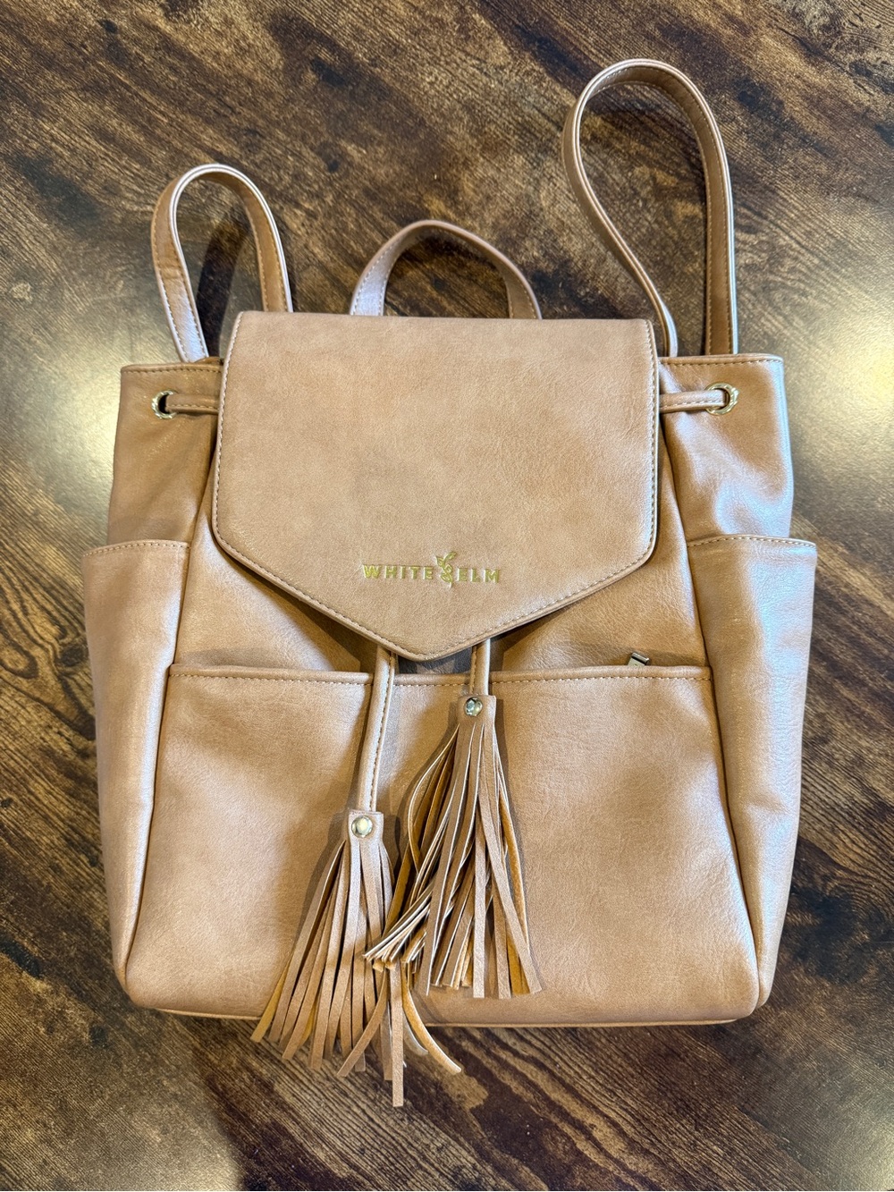 White Elm Tan Faux-Leather Backpack with Tassel Accents